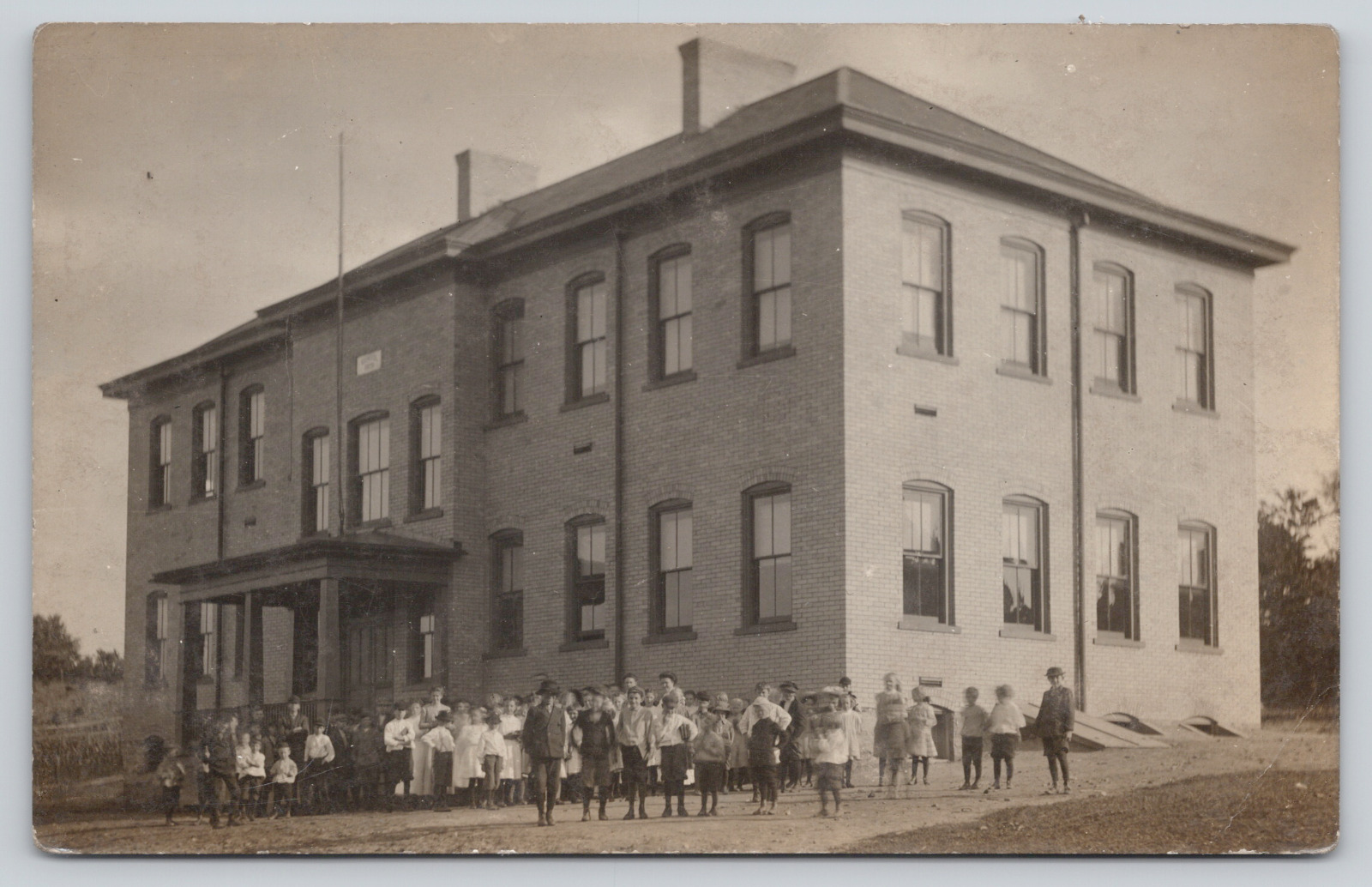 RPPC Unidentified Large Group of Children and Adults in front of Building A475