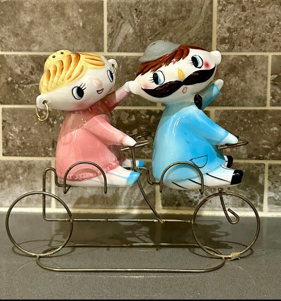 Vintage Relco Girl And Boy Shakers On Bike