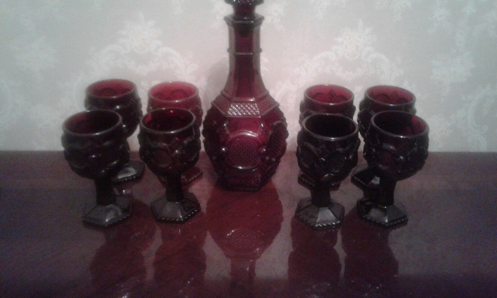 AVON CAPE CODE RUBY RED DECANTER AND EIGHT WINE GLASSES