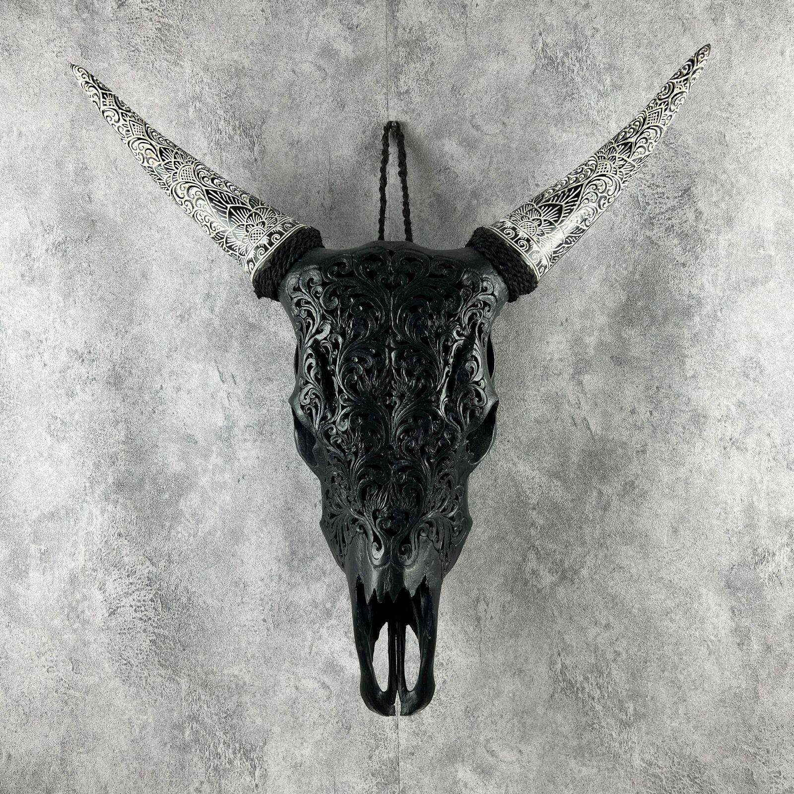 Hand-Carved Black Bull Skull with Intricate Patterns