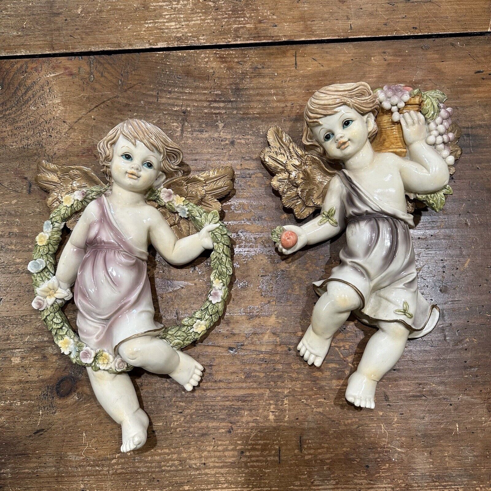 Pair of Winged Angel Cherubs Wall Plaques Figures Resin Floral Wreath and Fruit