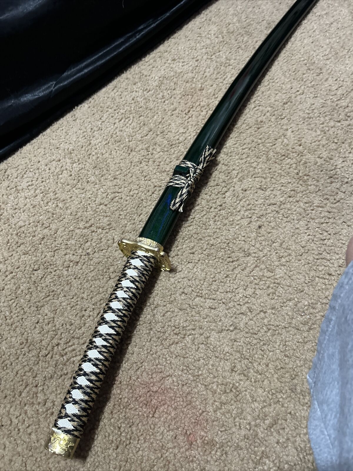 Emerald green, White leather handled sword