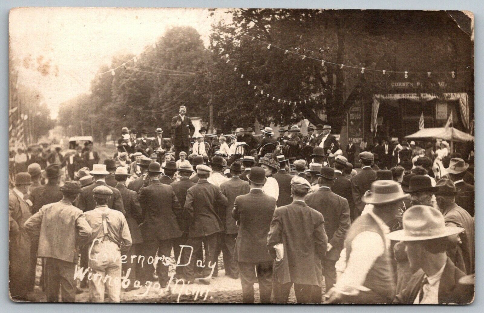 Winnebago MN~Governor\'s Day~Adolph O Eberhart Gives Speech~Corner Drug~1913 RPPC