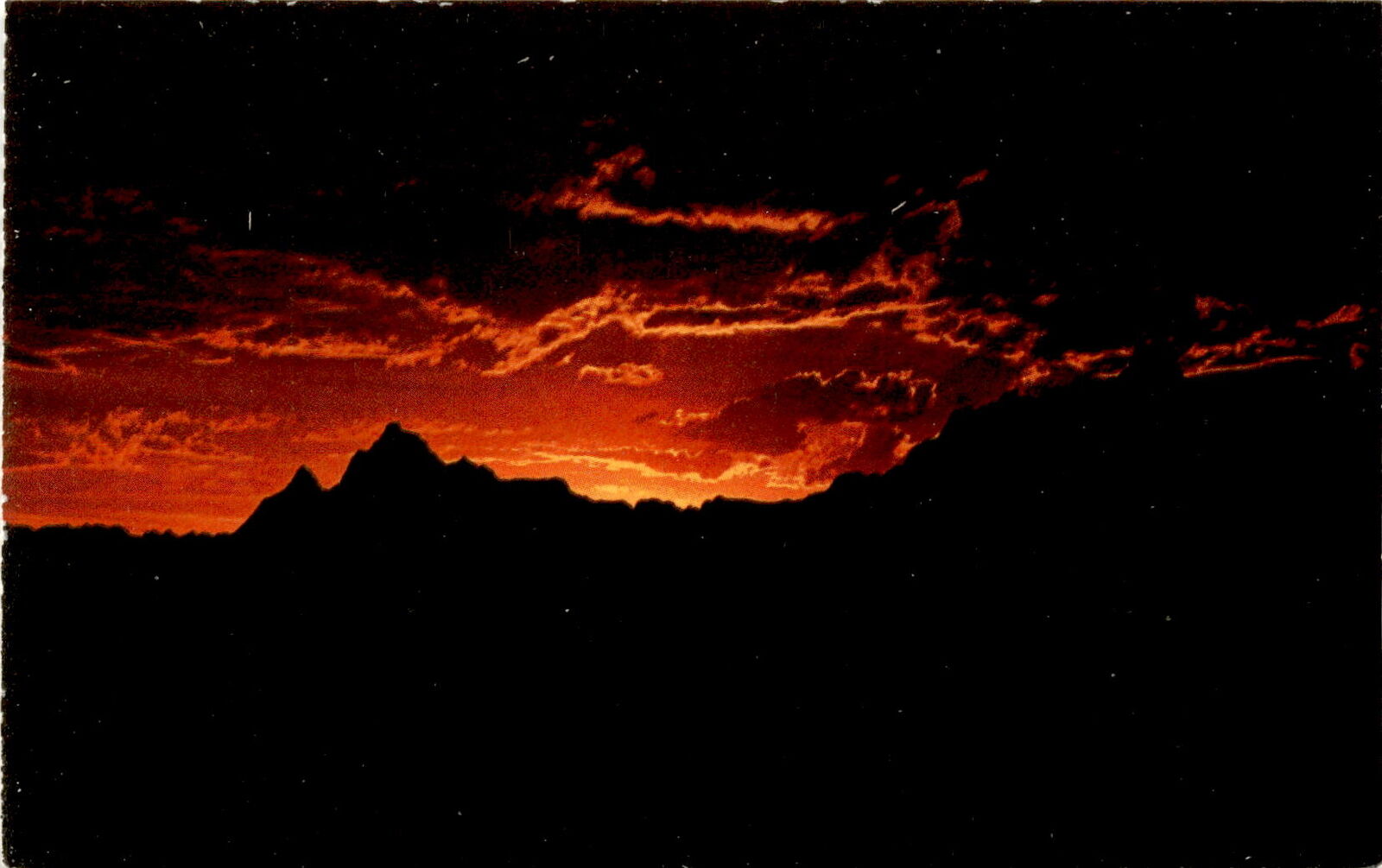 Stunning sunset in Badlands National Monument postcard souvenir