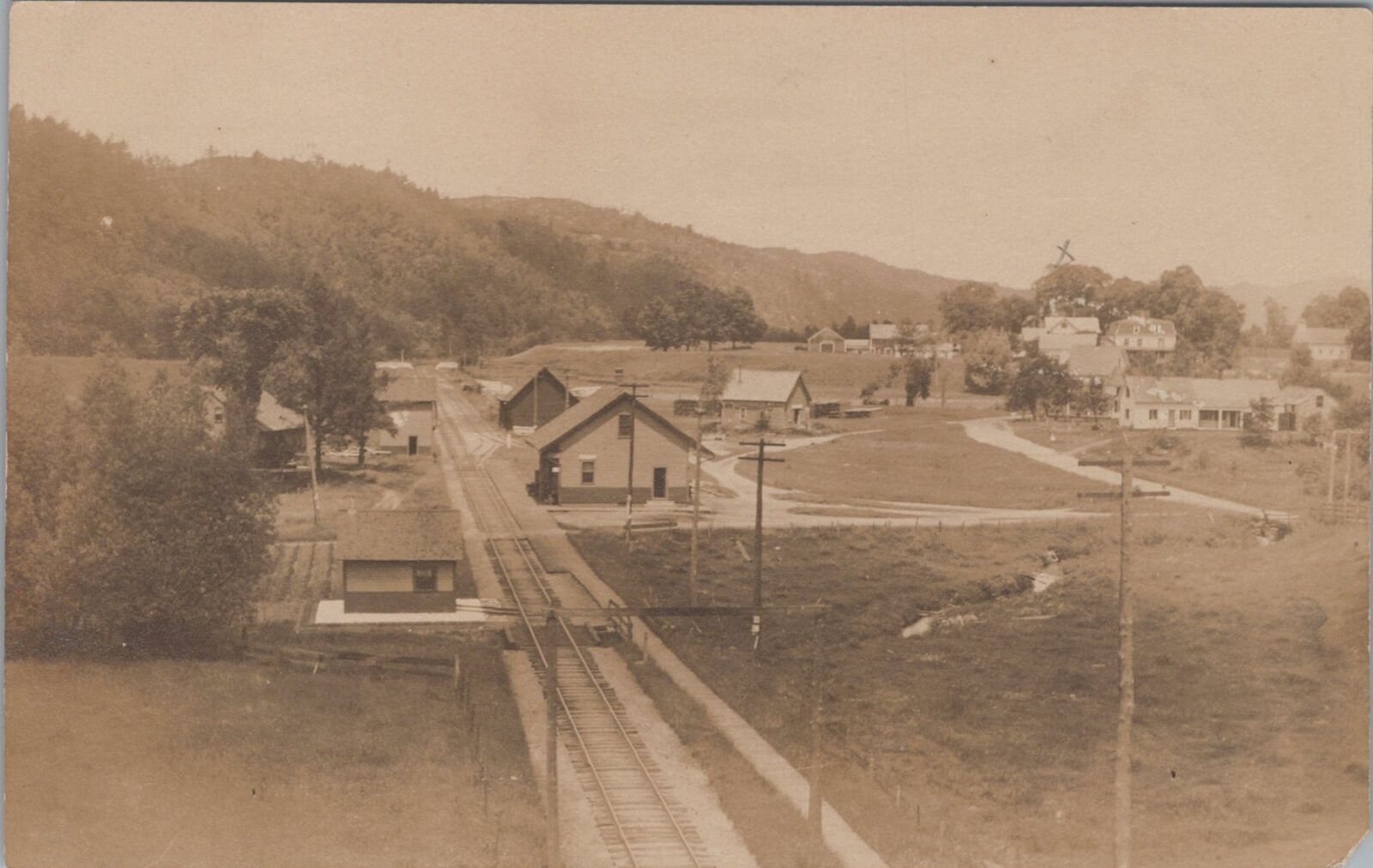 Newbury Vermont Train Station Depot Rail Tracks Houses c1910s RPPC Postcard