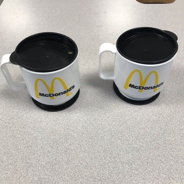 Two McDonald\'s Plastic Travel Coffee Mugs with lid and base