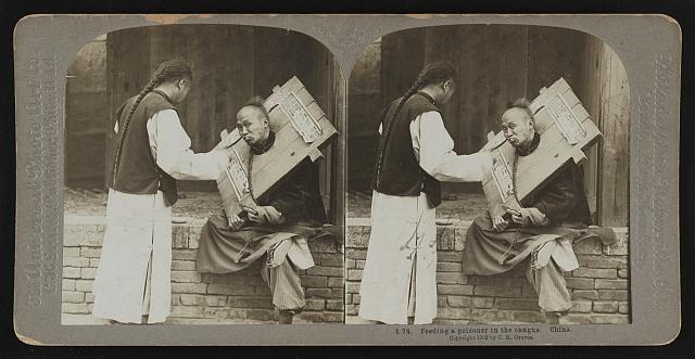Feeding a prisoner in the cangue China Old Photo