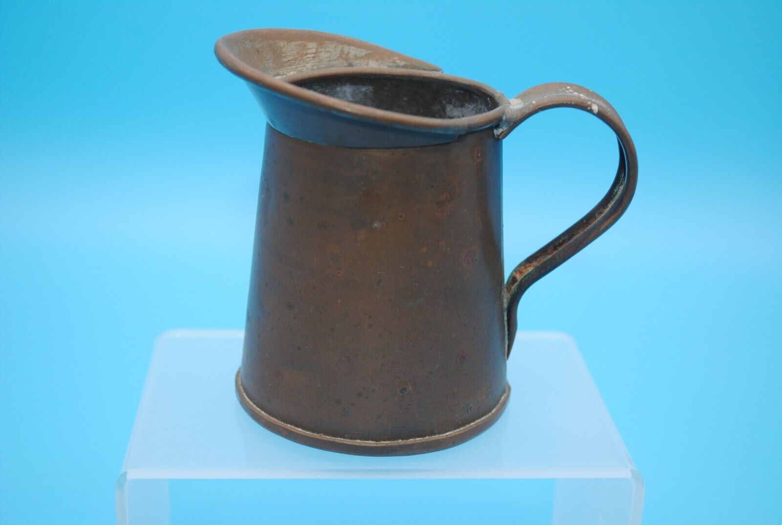 Antique solid copper pitcher. Handmade and may be a measuring cup.