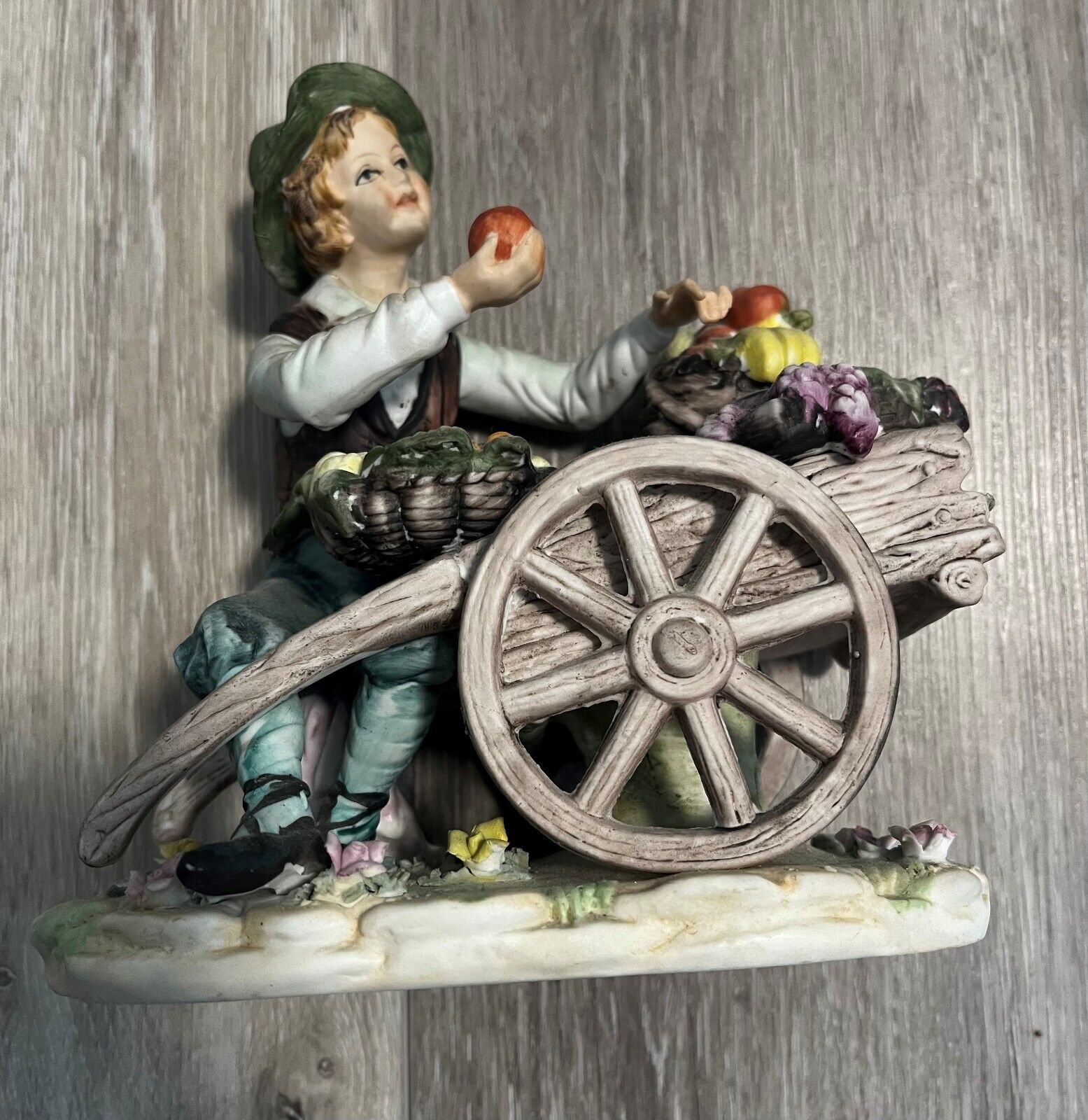Porcelain/Bisque Colonial Man Figurine With a Cart of Fruit