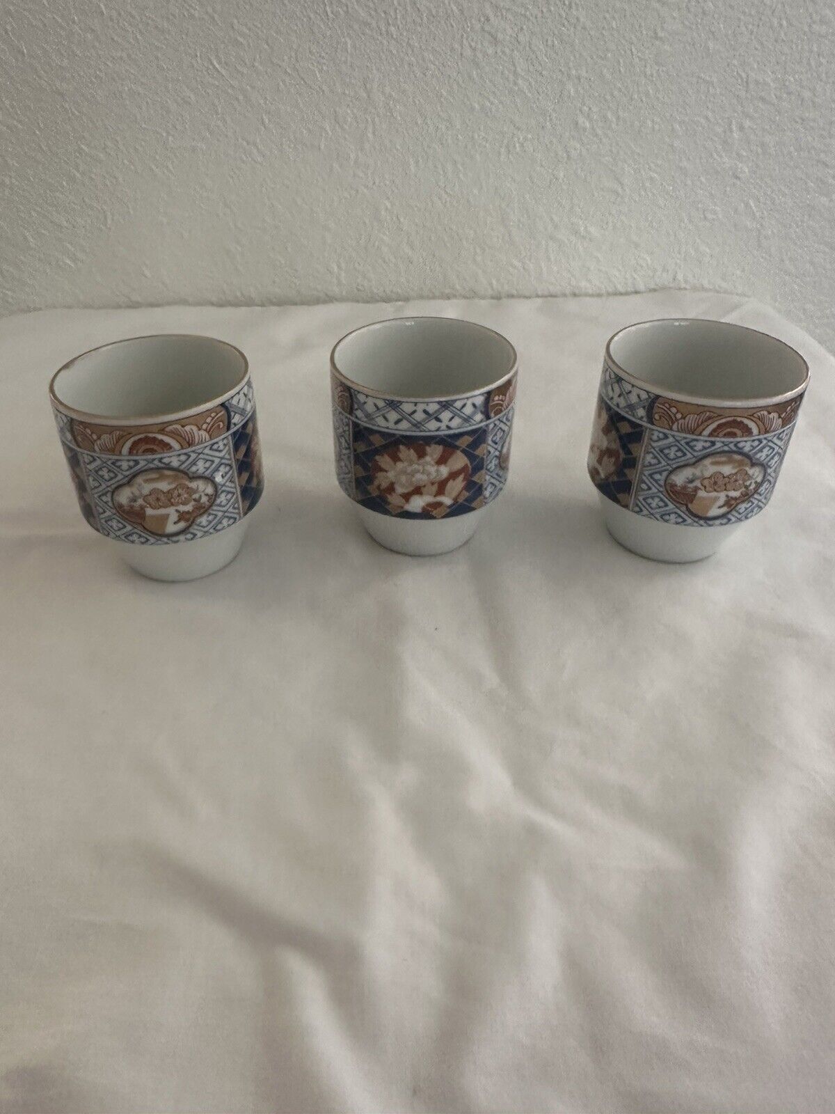 Lot Of 3 Vintage OMC Saki/teacups Hand painted and Made In Japan.
