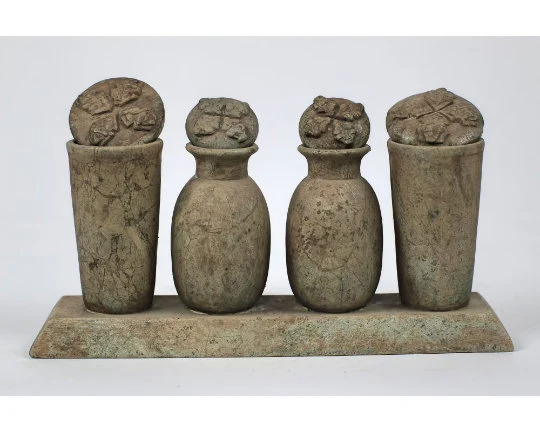 Exquisite Ancient Egyptian set of healing jars with beautiful carvings on lids