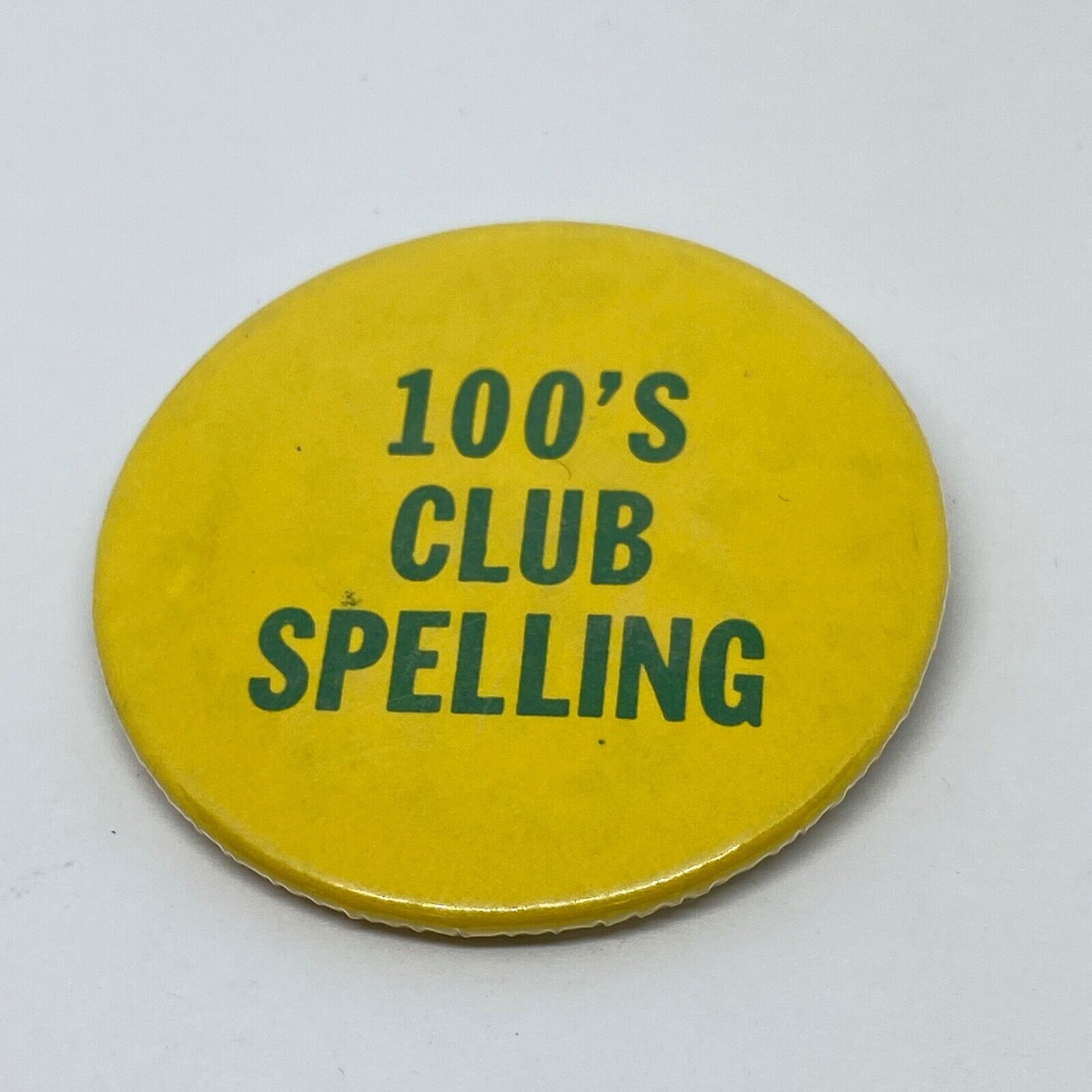 Vintage 100\'s Club Spelling Button Pin