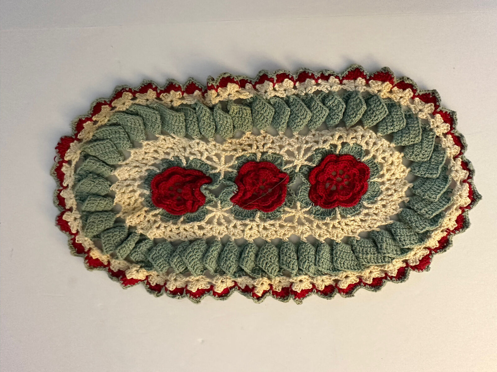 Vintage Hand Crocheted floral red green oval doily 13 x 7