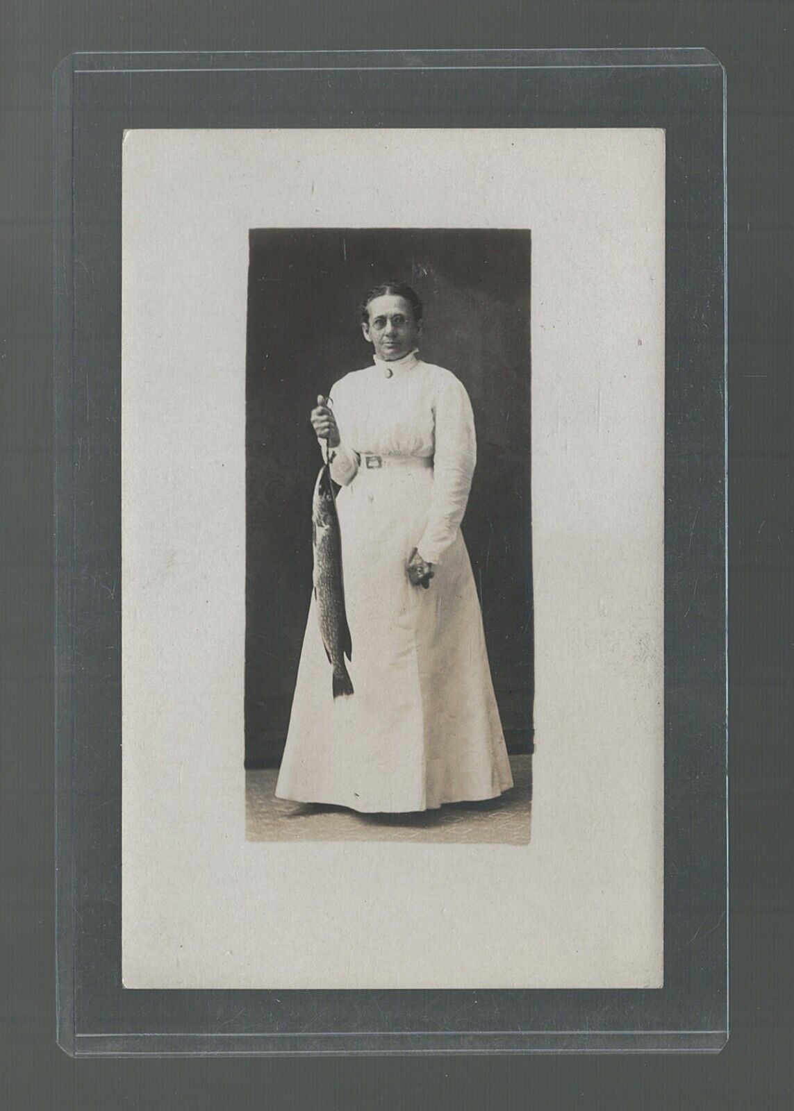 RPPC Lady In A White Dress Holding A Northern Pike Fish Stringer