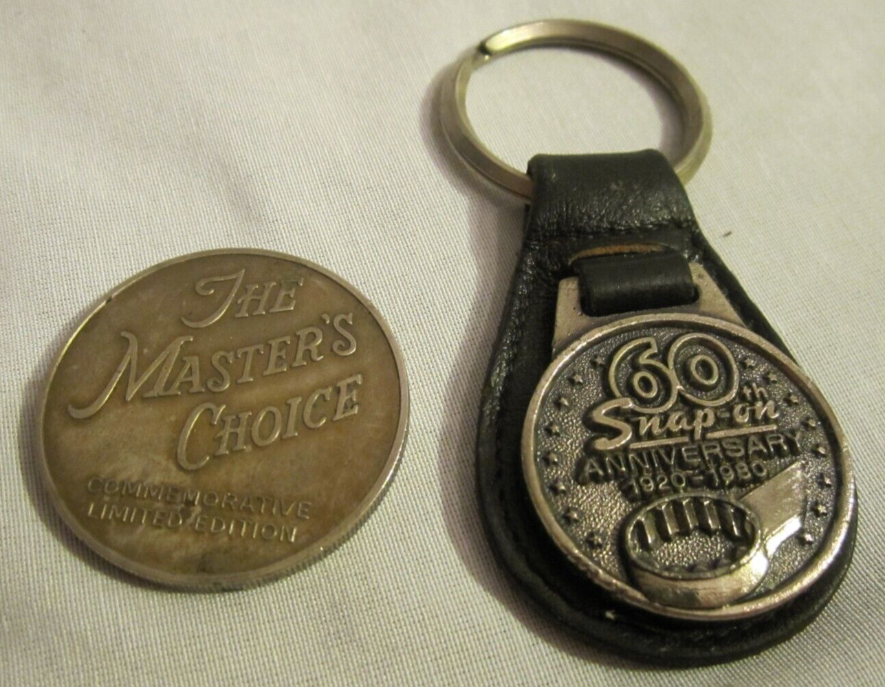 2 SNAP-ON-TOOLS 60th Anniversary Gold Tone Coin The Masters Choice Key Chain FOB