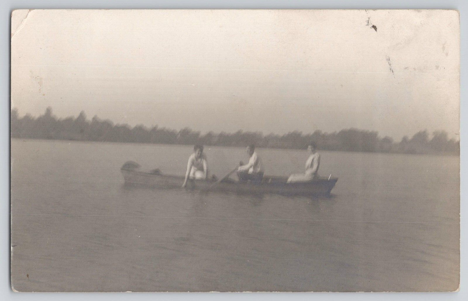 Postcard RPPC 2 Women And A Man In A Row Boat On A Calm Lake. c1915