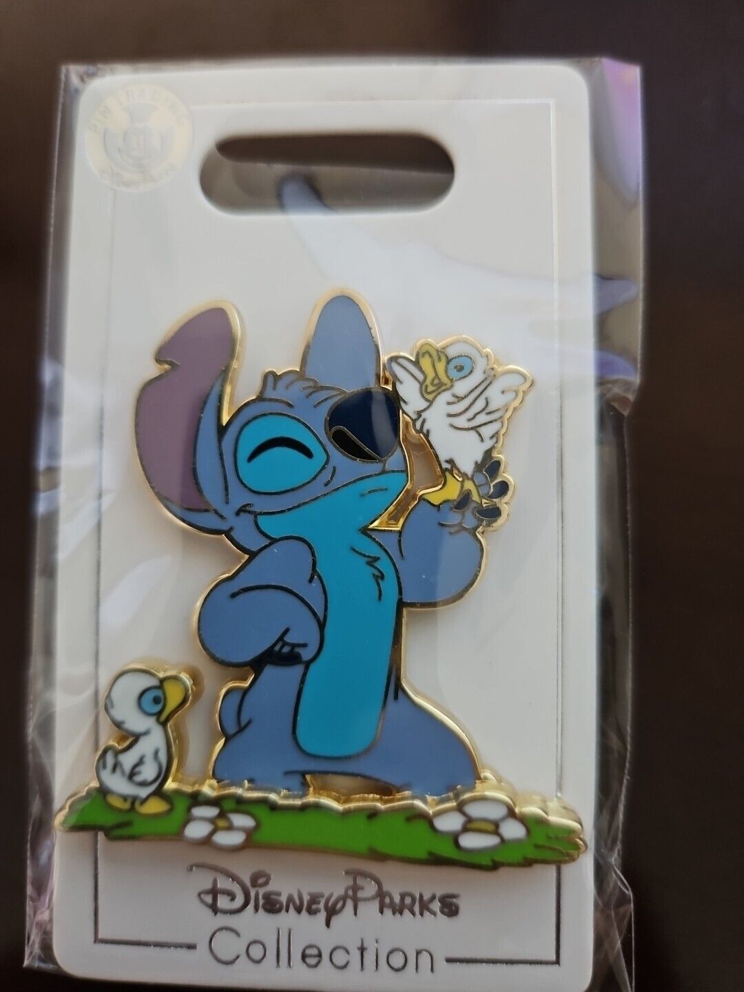 Disney Pin Trading Stitch Smiling At Baby Ducks In The Grass