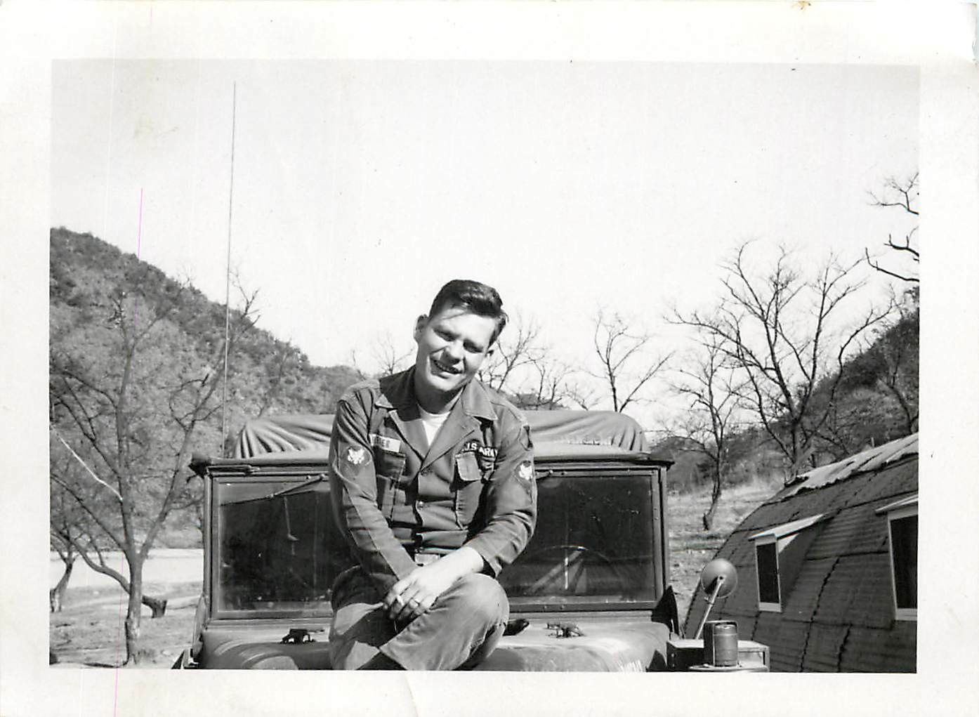 Snapshot B/W Photo 1960 Korea US Army Soldier Sitting on Hood of Truck