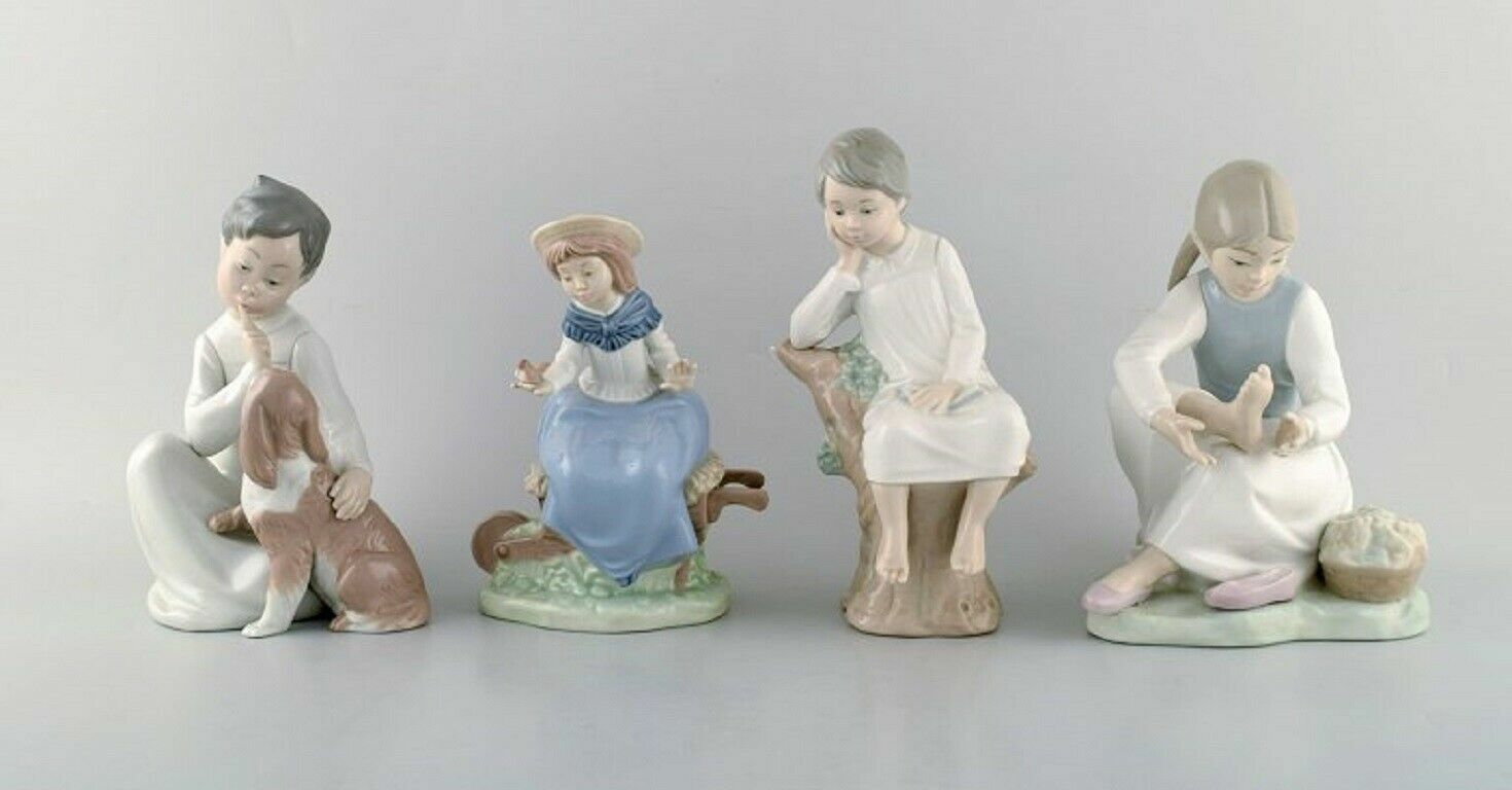Lladro and Nao, Spain. Four porcelain figurines of children. 1980 / 90's