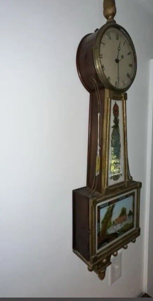Antique weight driven banjo clock