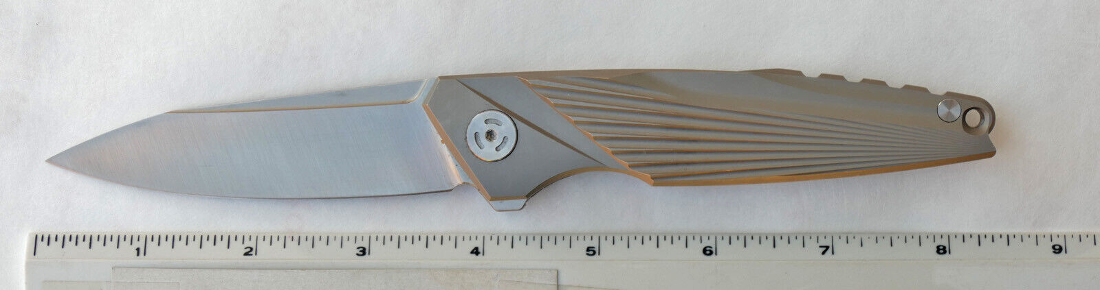 Titanium handle folding knife with 3-1/2” M390 plain blade