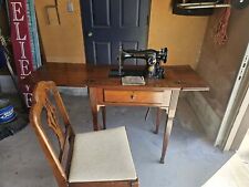 Vintage Singer sewing machine in cabinet picture