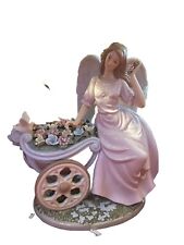 Vintage O'Well large Porcelain Angel Figure Sitting on Flower Cart picture
