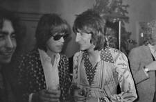 Ronnie Wood of rock band the Faces talks to Mick Jagger 1970s OLD PHOTO picture