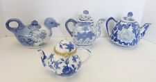 Four Miniature Blue and White Teapots picture