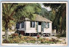 1937 NASSAU BAHAMAS NATIVE THATCHED COTTAGE CHILD ON STEPS CHICKEN POSTCARD picture