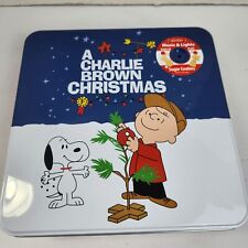 A Charlie Brown Christmas Collectible Cookie Tin w Lights & Peanuts Theme Song picture