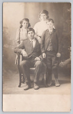 Postcard Portrait of Four Children Dressed Up in Sunday Clothes, Vintage RPPC picture