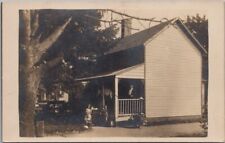c1910s RPPC Photo Postcard Family Posing on House Porch / U.S. American Flags picture