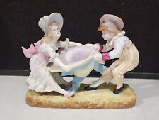 ANTIQUE FRENCH OR GERMAN BISQUE PORCELAIN BOY & GIRL HAT TUG OF WAR FIGURINE picture