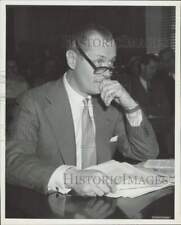 Press Photo Robert Montgomery sitting at a desk - afx30970 picture