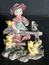 Doll Figurine Holding Bowl With Ducks picture