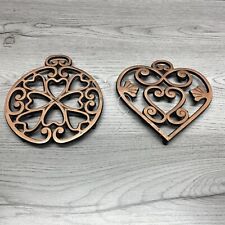 Pampered Chef Trivets One Round and One Heart Shaped. Copper color Heavy picture