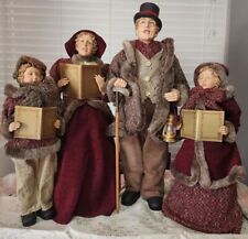 4 Christmas Carolers figurines with real clothing  resin. The tallest  30” Rare picture