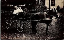 c1910 BOY WITH BOWTIE GIRL DRIVING HORSE DRAWN CART REAL PHOTO POSTCARD 29-160 picture