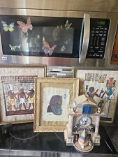 egyptian home decor, art work on papyrus framed, coffee table books. picture