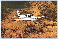 Postcard The Beechcraft Model 33 Debonair Over The Sangre De Cristo Range CO picture
