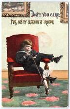 1913 DON'T YOU CARE I'M ONLY SMOKIN' ROPE*LITTLE BOY SMOKING PIPE POSTCARD picture