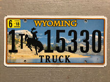 WYOMING LICENSE PLATE BUCKING BRONCO/ MOUNTAINS RANDOM LETTERS/NUMBERS TRUCK picture