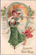 1908 NEW YEAR Embossed Greetings Postcard Angel ICE SKATING with Pretty Lady picture