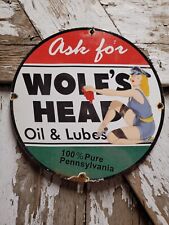 VINTAGE WOLFS HEAD PORCELAIN SIGN 1948 GAS PUMP PLATE LADY MOTOR OIL LUBRICATION picture