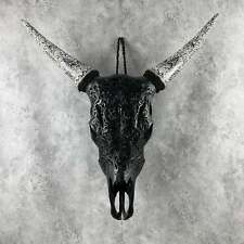 Hand-Carved Black Bull Skull with Intricate Patterns picture