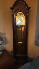 Sligh Grandfather clock. beautiful wood with gold face. picture