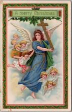 c1910s MERRY CHRISTMAS Embossed Postcard Angel Woman w/ Cross / Cherubs - UNUSED picture