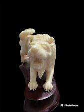 FINELY CARVED IVORY ASIAN NON COMPOSITE LION FIGURE ON CARVED WOODEN PLINTH picture