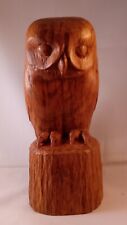 Tawny Owl carved in Brown English Oak displayed on sitting on a tree stump  picture
